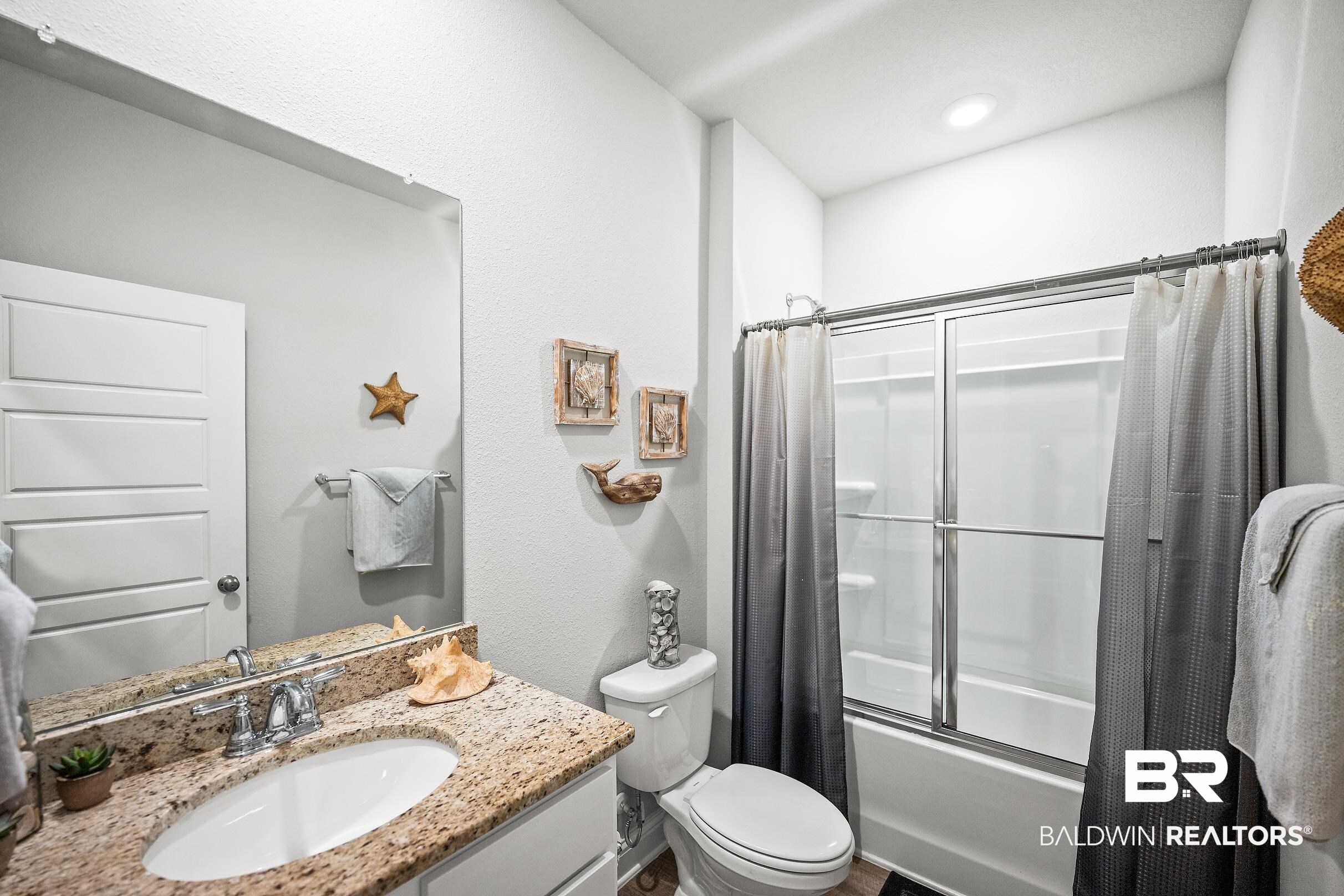 31468 Memphis Loop Daphne, AL 36527 - Photo 15 of 24 Full bath with enclosed tub / shower combo, vanity, and a textured wall