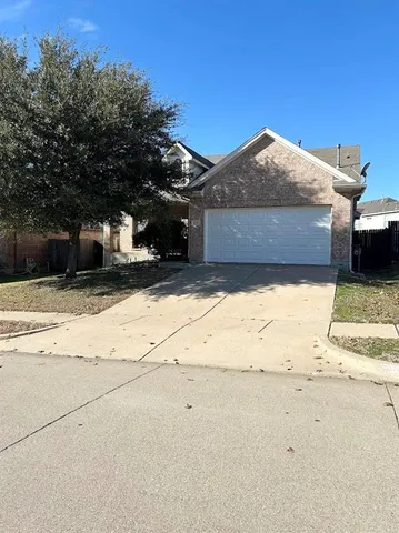a view of a house with a snow in the yard