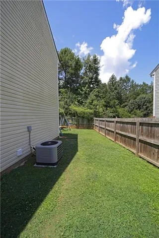 a view of a backyard with sitting area