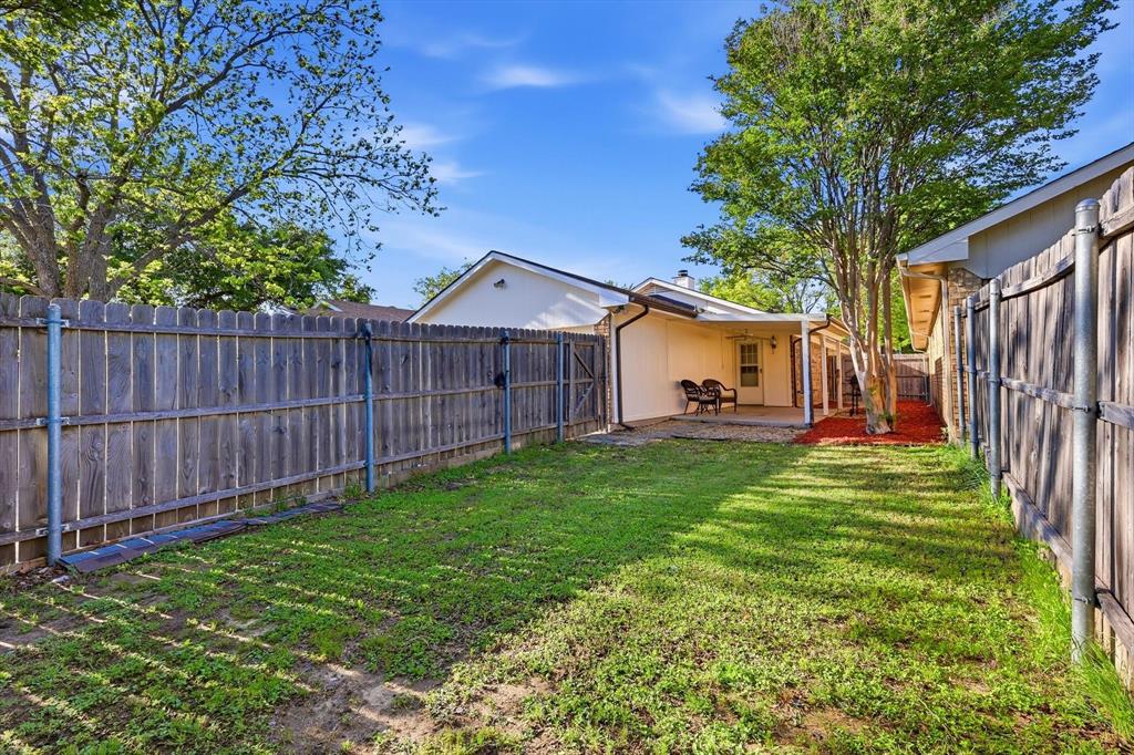 1312 Hackamore Street Mesquite, TX 75149 - Photo 21 of 23 Fenced backyard with a patio area