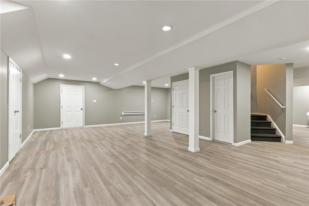 1657 Rachel Road Stroudsburg, PA 18360 - Photo 32 of 46 Smooth wood-look flooring and recessed lighting define this versatile finished basement level.