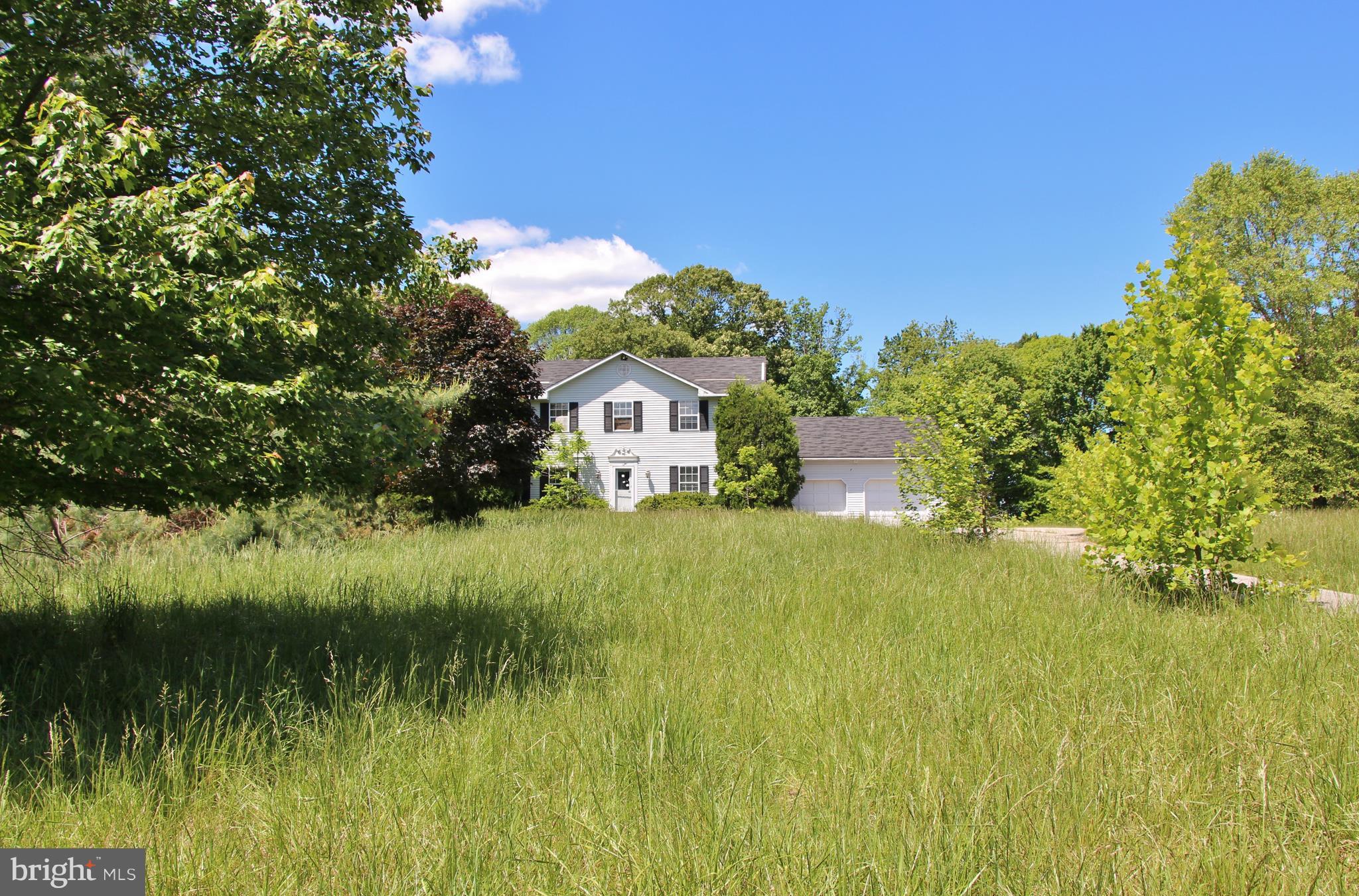 3025 Holland Cliffs Road Huntingtown, MD 20639 - Photo 1 of 12 a view of a house with a big yard