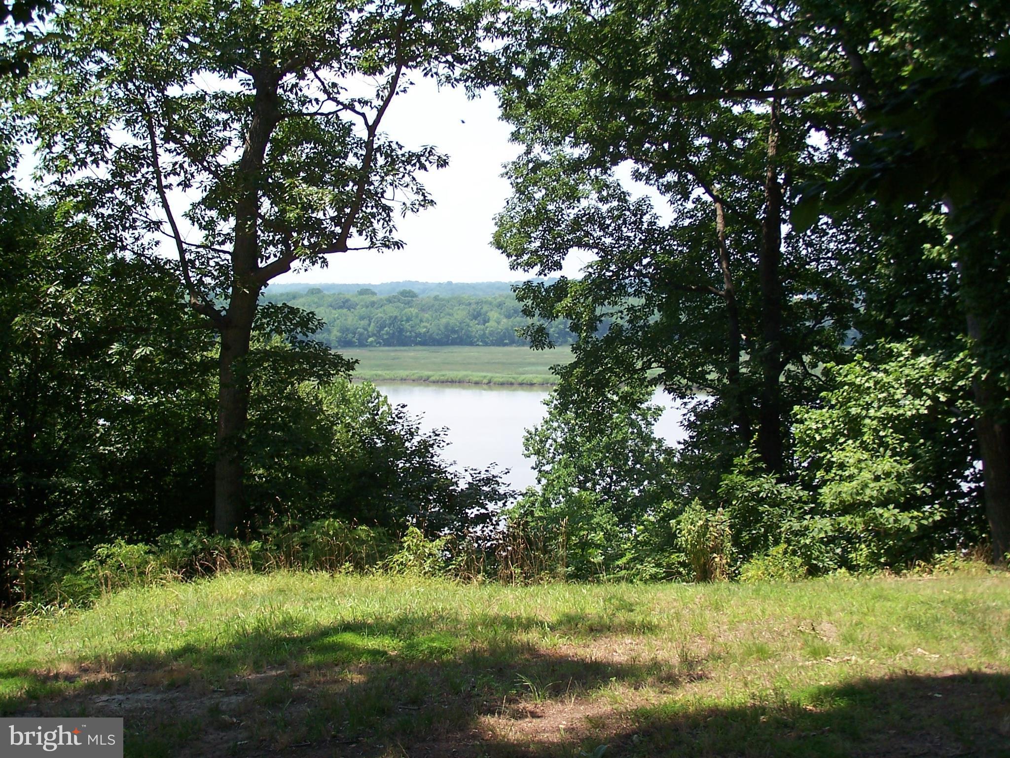 3025 Holland Cliffs Road Huntingtown, MD 20639 - Photo 4 of 12 a view of lake with green space