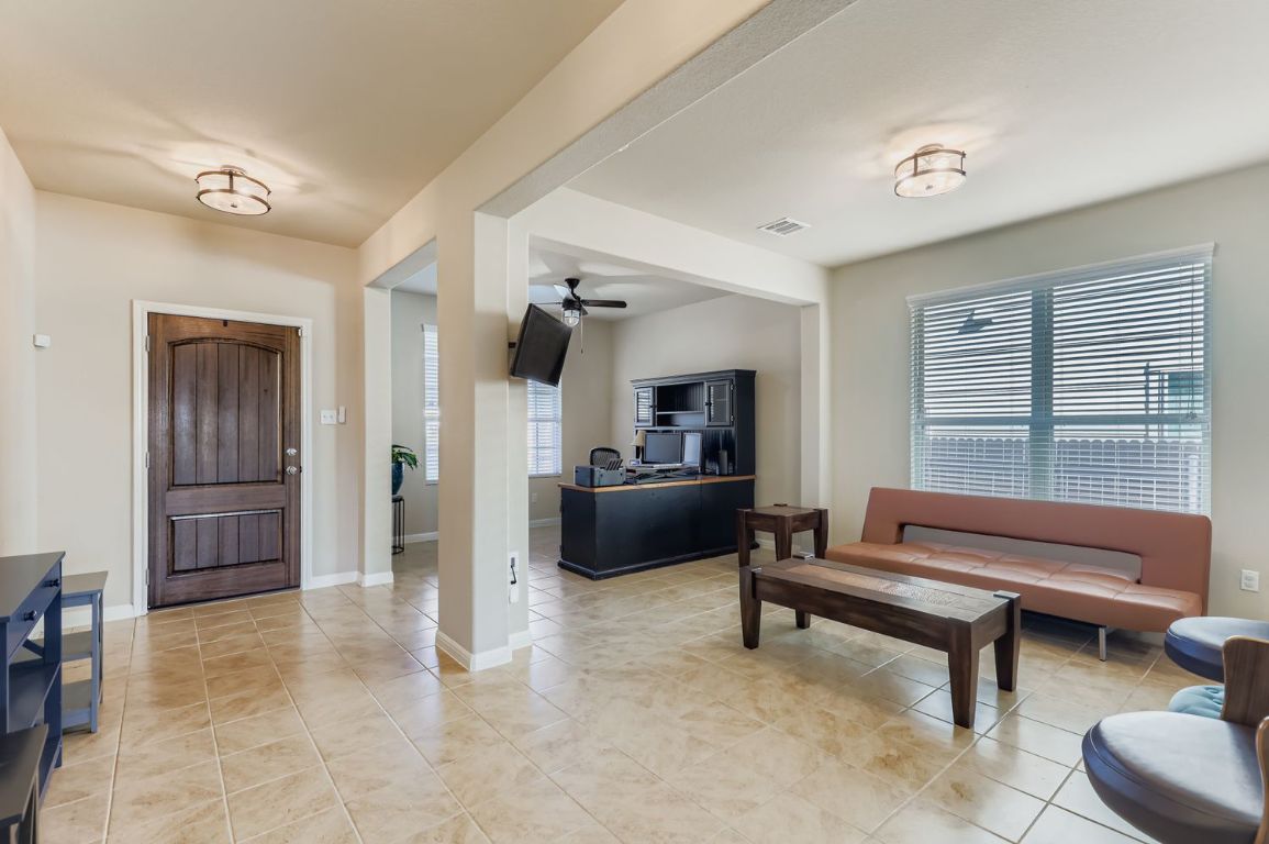 19433 Colgin Drive Pflugerville, TX 78660 - Photo 9 of 29 a living room with furniture and a rug