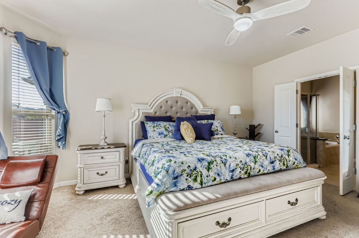 19433 Colgin Drive Pflugerville, TX 78660 - Photo 13 of 29 a bedroom with a bed and a dresser