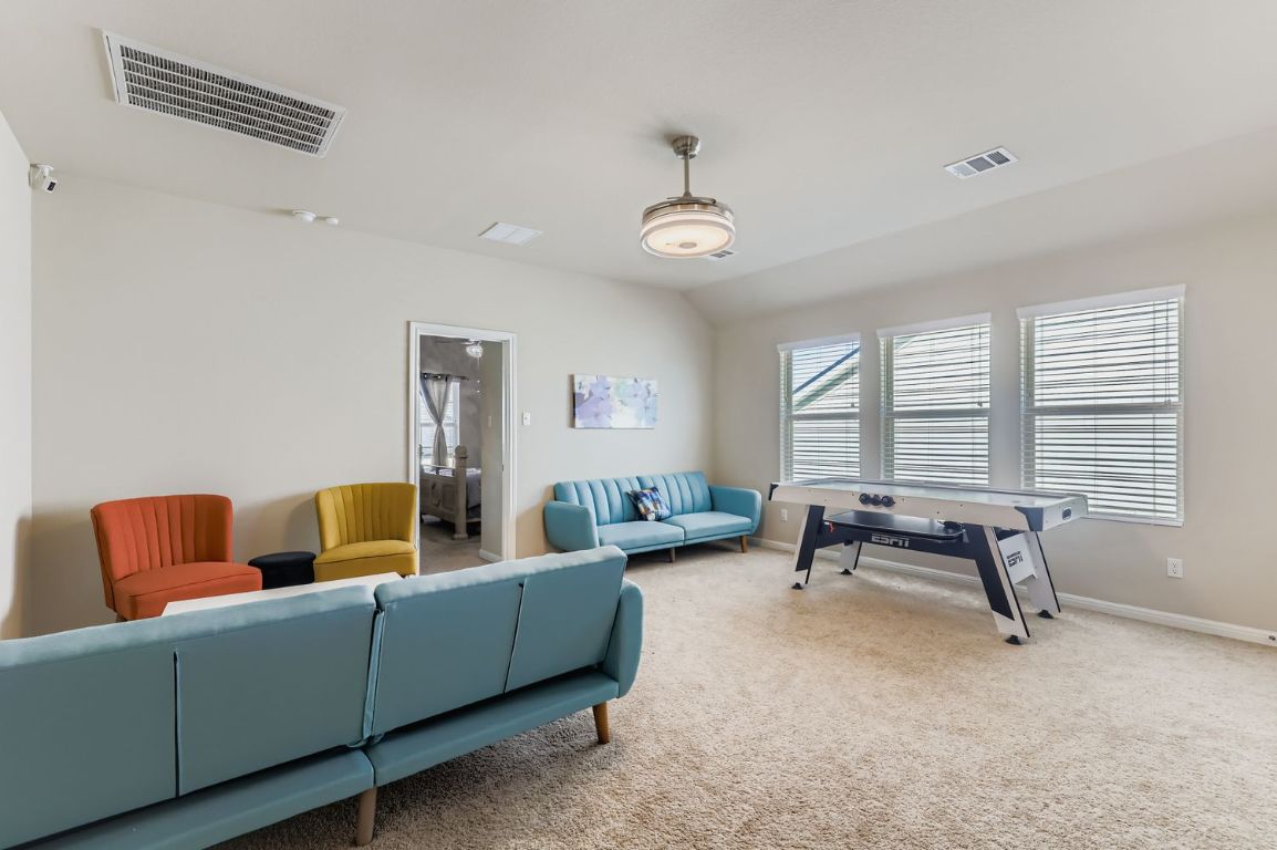 19433 Colgin Drive Pflugerville, TX 78660 - Photo 23 of 29 a living room with furniture and a large window
