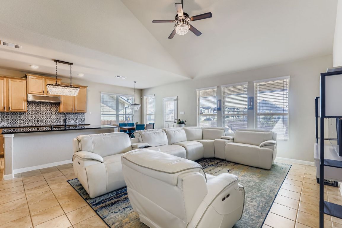 19433 Colgin Drive Pflugerville, TX 78660 - Photo 5 of 29 a living room with furniture and a large window