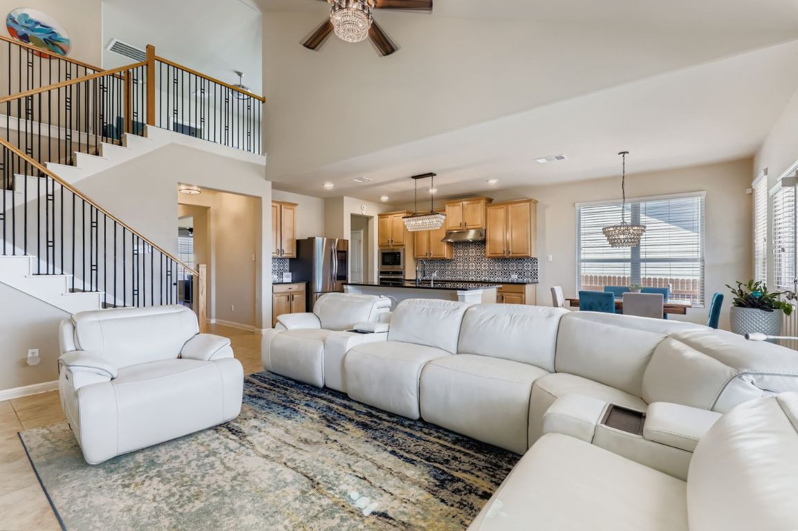 19433 Colgin Drive Pflugerville, TX 78660 - Photo 6 of 29 a living room with furniture and a large window