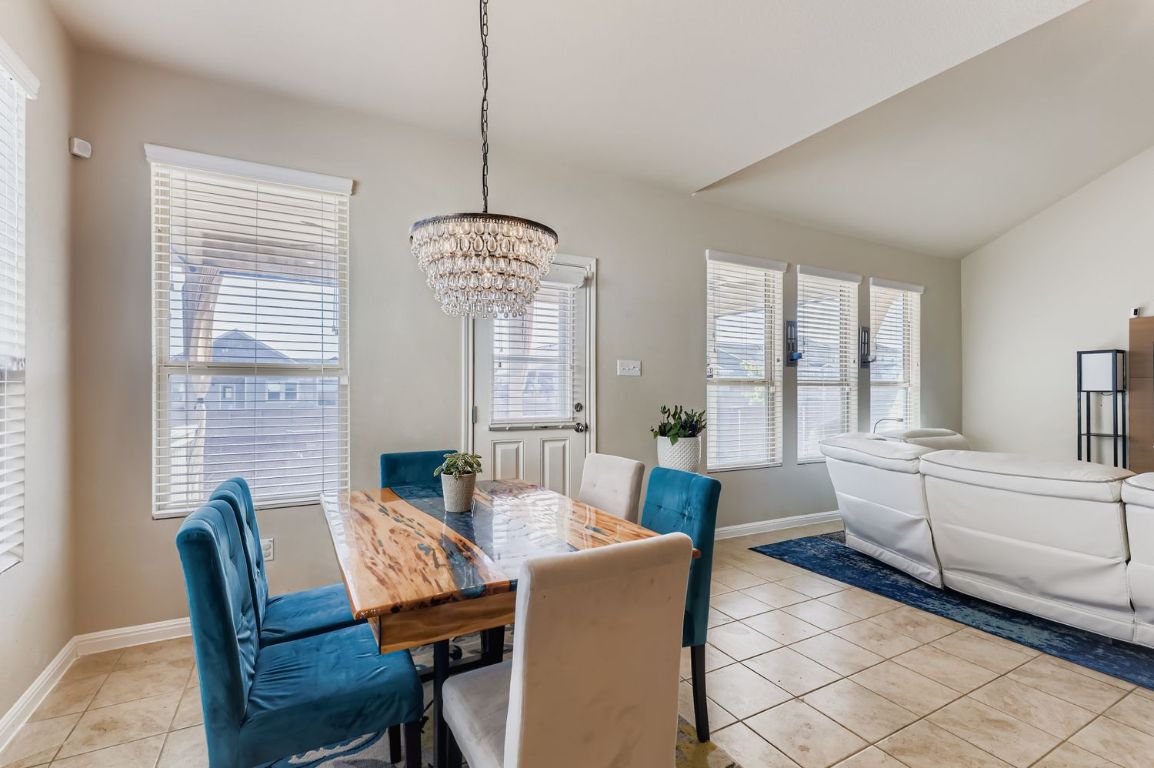 19433 Colgin Drive Pflugerville, TX 78660 - Photo 8 of 29 a view of a dining room with furniture window and outside view