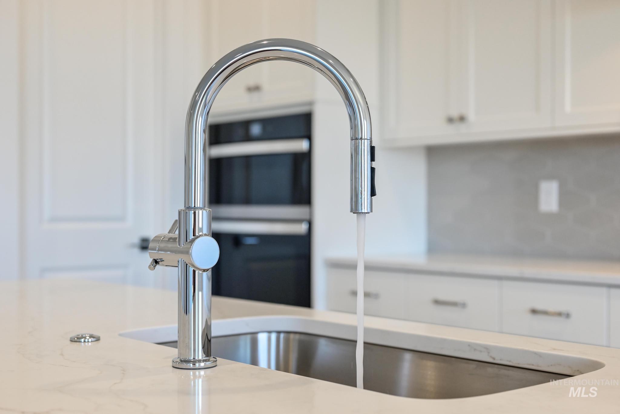 9800 West Novato Street Star, ID 83669 - Photo 15 of 40 Kitchen view of white cabinetry and light stone counters
