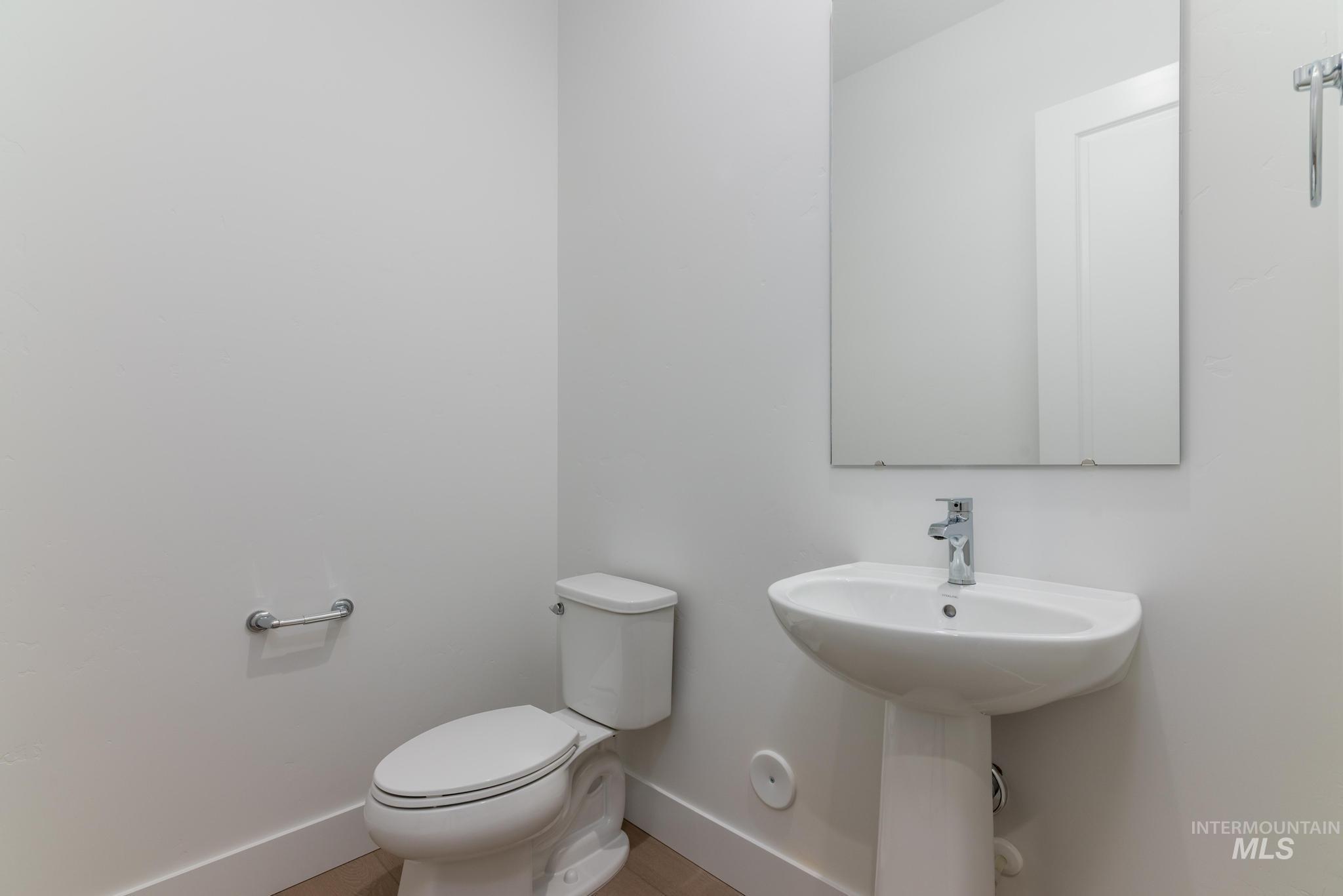 9800 West Novato Street Star, ID 83669 - Photo 18 of 40 Half bath featuring baseboards and toilet