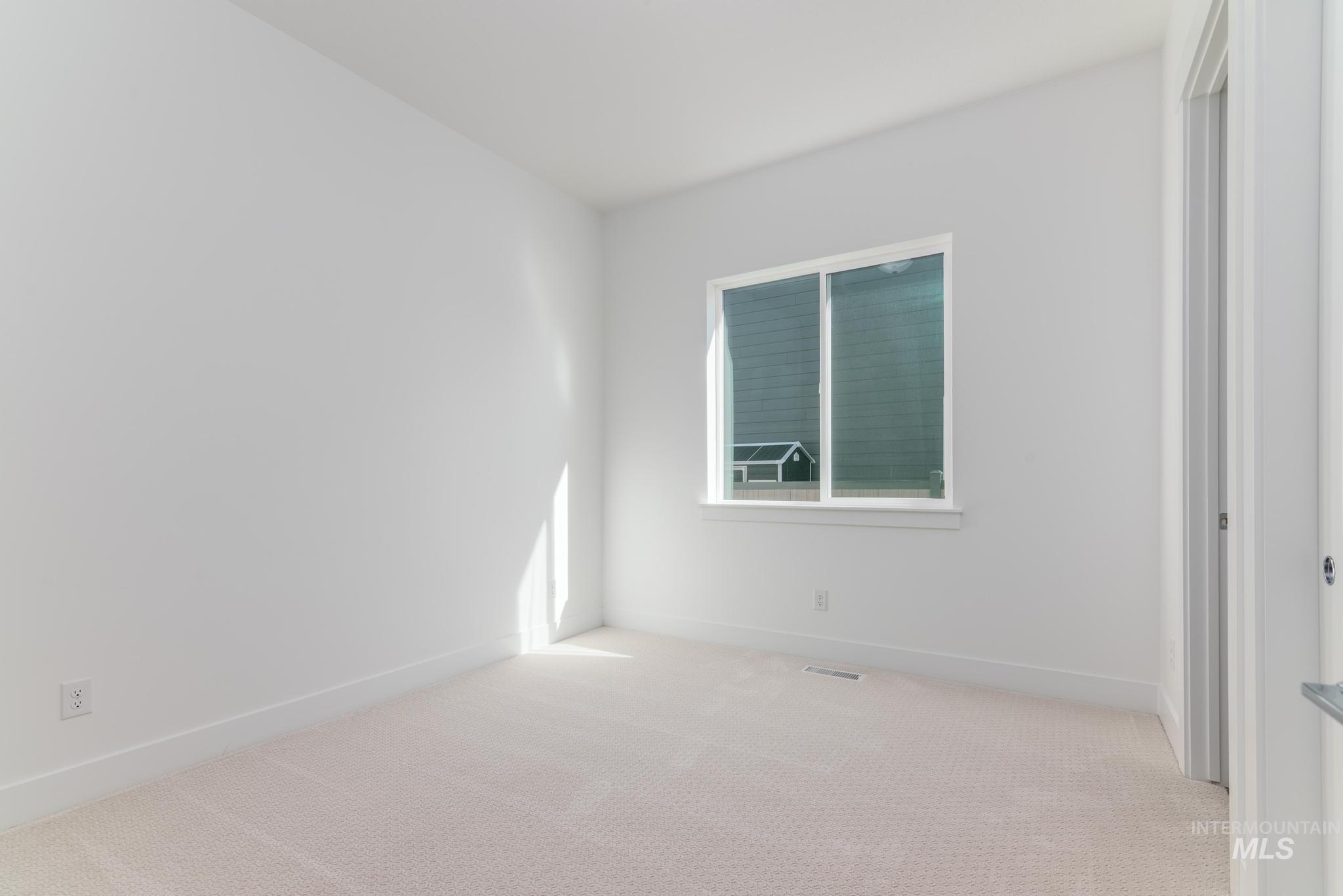 9800 West Novato Street Star, ID 83669 - Photo 24 of 40 Spare room with light colored carpet and baseboards