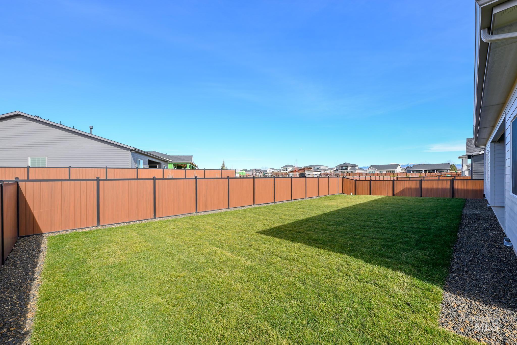 9800 West Novato Street Star, ID 83669 - Photo 29 of 40 Fenced backyard with a residential view