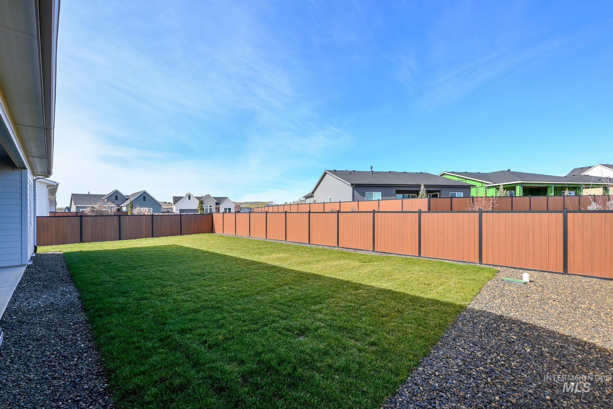 9800 West Novato Street Star, ID 83669 - Photo 30 of 40 Fenced backyard with a residential view