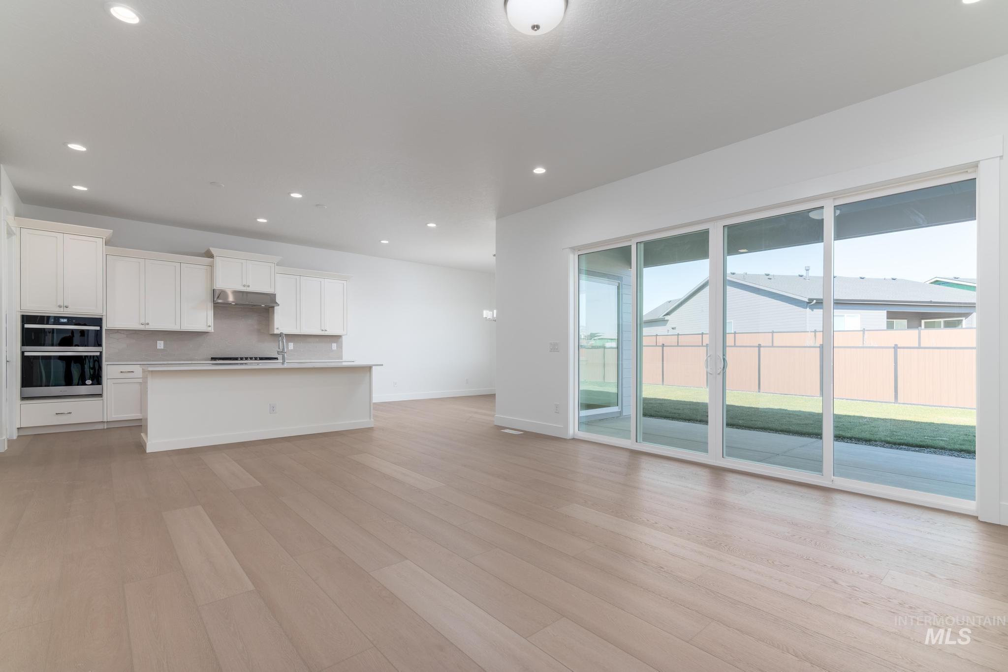 9800 West Novato Street Star, ID 83669 - Photo 7 of 40 Unfurnished living room featuring recessed lighting and light wood-style floors