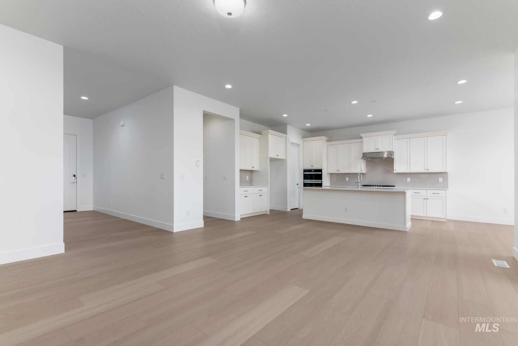 9800 West Novato Street Star, ID 83669 - Photo 8 of 40 Unfurnished living room featuring light wood-type flooring and recessed lighting