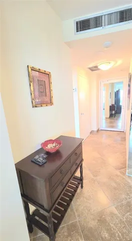 a living room with a table and a couch