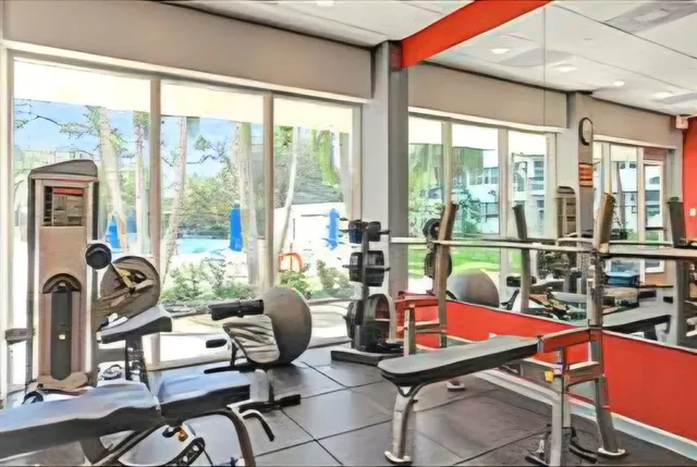 a view of a dining room with furniture and window