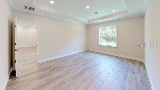 Tbd Mohawk Road Venice, FL 34293 - Photo 9 of 16 an empty room with wooden floor and windows