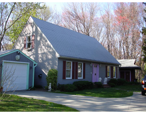 1976 Wilbraham Road Springfield, MA 01129 - Photo 2 of 12 a front view of a house with a garden and plants