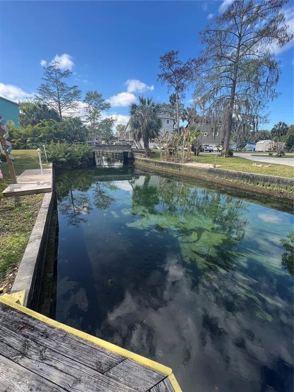 7222 Tropical Drive Weeki Wachee, FL 34607 - Photo 4 of 23 a view of a lake from a yard