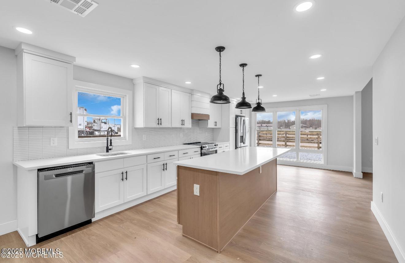 23 A Stoney Hill Road Cream Ridge, NJ 08514 - Photo 13 of 46 a large kitchen with stainless steel appliances a large center island and a sink