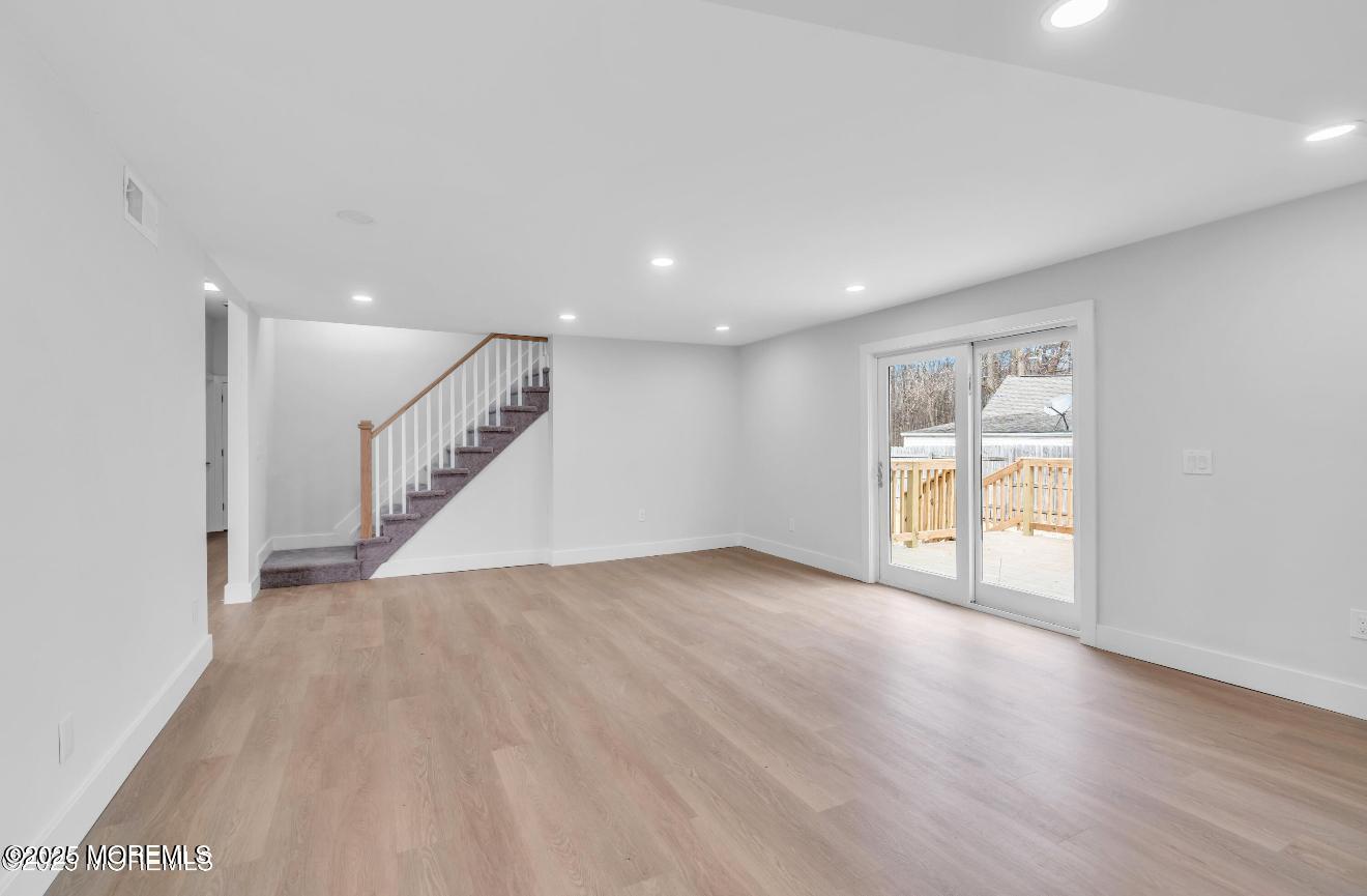 23 A Stoney Hill Road Cream Ridge, NJ 08514 - Photo 16 of 46 a view of an empty room with wooden floor and a window