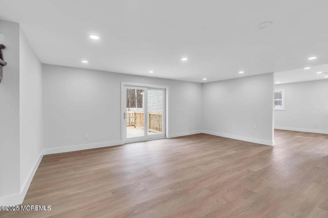 23 A Stoney Hill Road Cream Ridge, NJ 08514 - Photo 18 of 46 a view of an empty room with wooden floor and windows