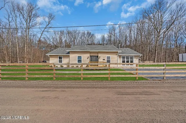 a front view of house with a small yard