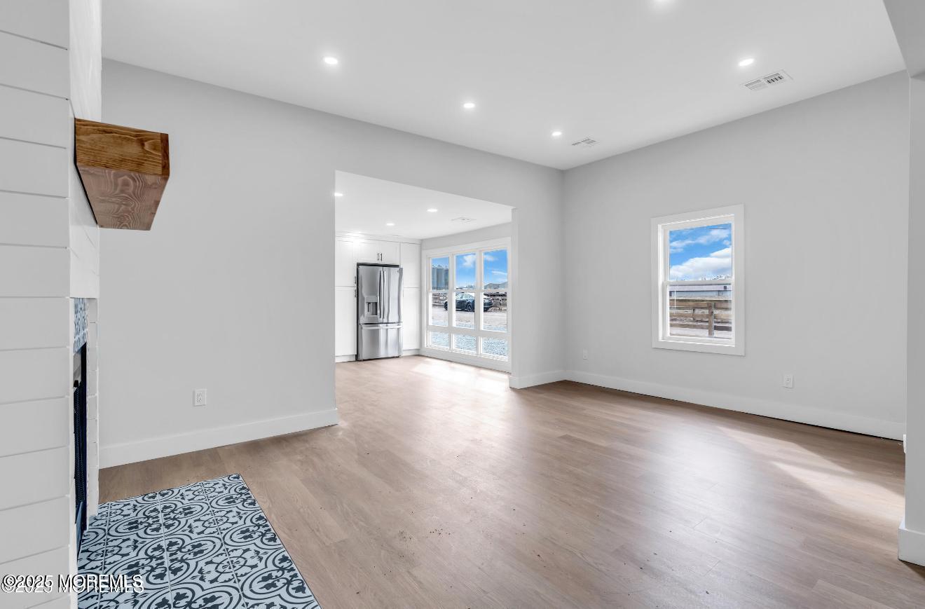 23 A Stoney Hill Road Cream Ridge, NJ 08514 - Photo 6 of 46 a view of an empty room with wooden floor and a window