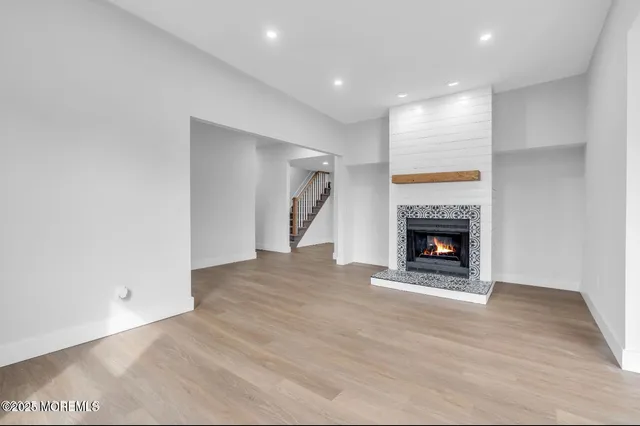 a view of empty room with a fireplace