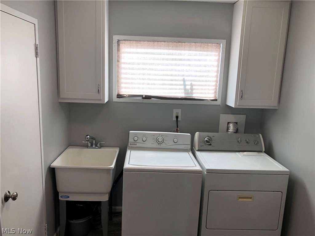 6374 Sherborn Road Parma Heights, OH 44130 - Photo 16 of 19 Bright & cheery 1st floor laundry w/ a utility tub.