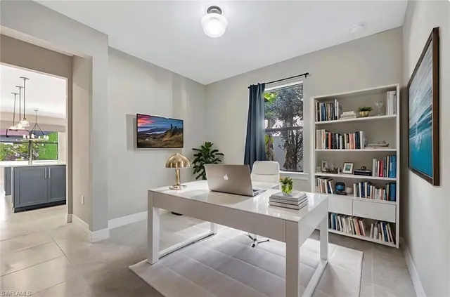 a workspace with furniture and window