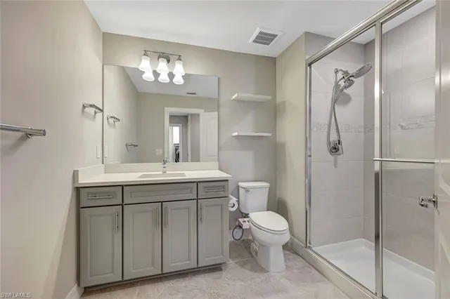 a bathroom with a bathtub shower sink mirror and toilet