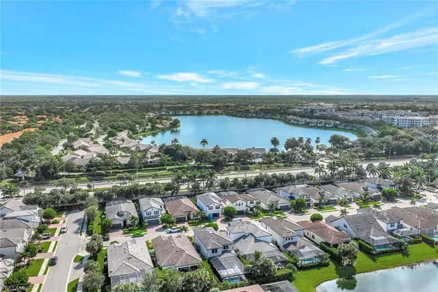 an aerial view of residential building with outdoor space and ocean