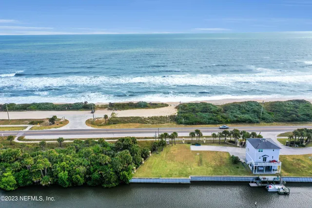 a view of a swimming pool with an ocean view