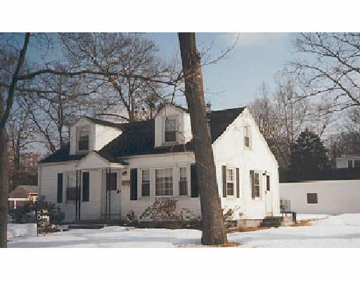 211 Powell Avenue Springfield, MA 01118 - Photo 1 of 1 a front view of a house with a yard