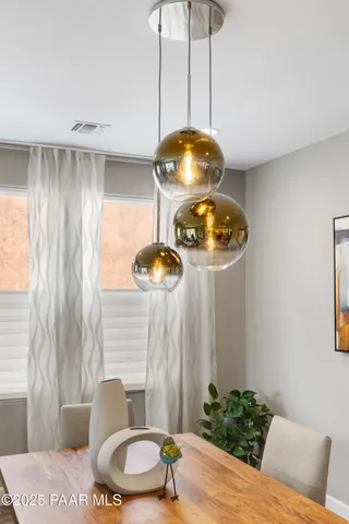 a large kitchen with a table and chairs