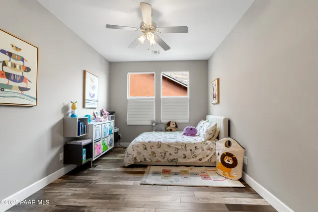 a bedroom with a bed and a stove