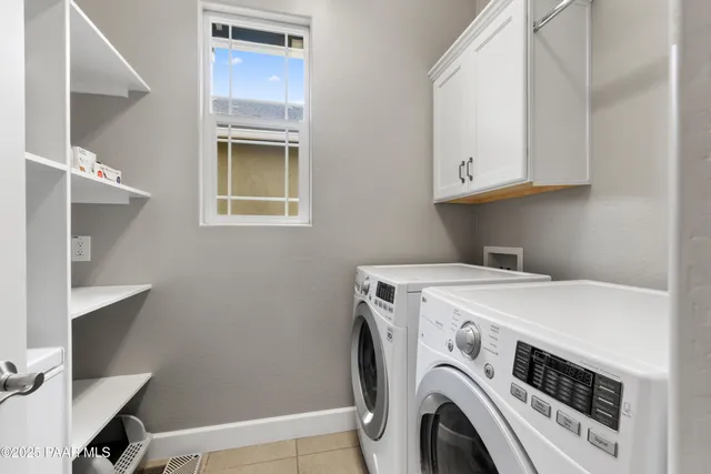 a view of a patio with couches and a fire pit and a yard