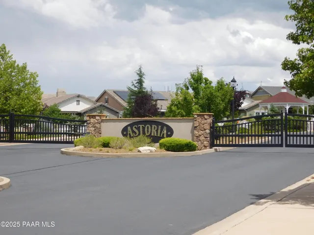 a front view of building with yard