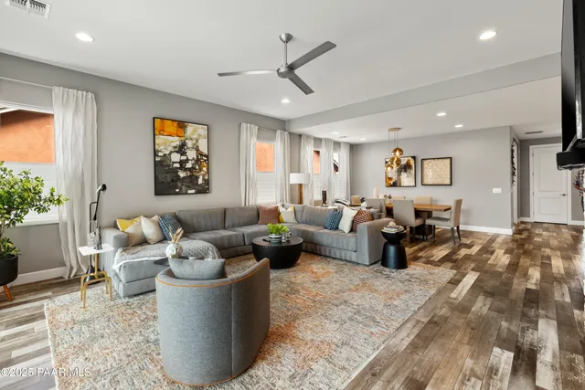 a living room with fireplace furniture and a flat screen tv