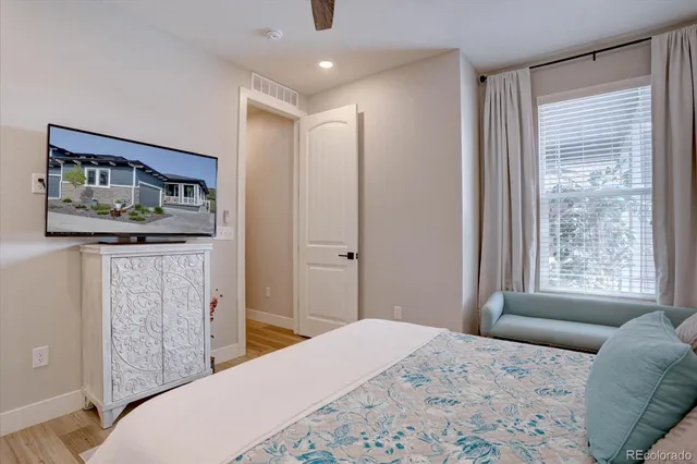 a bedroom with a bed and a dresser