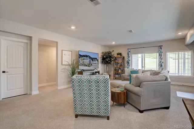 a living room with furniture and a window