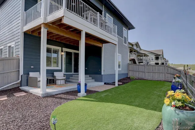 a view of a house with a yard and porch