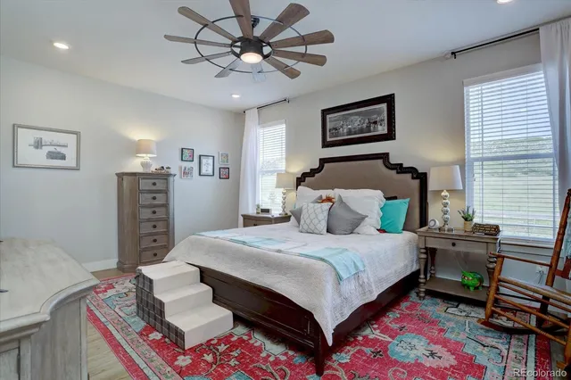 a bedroom with bed and a chandelier