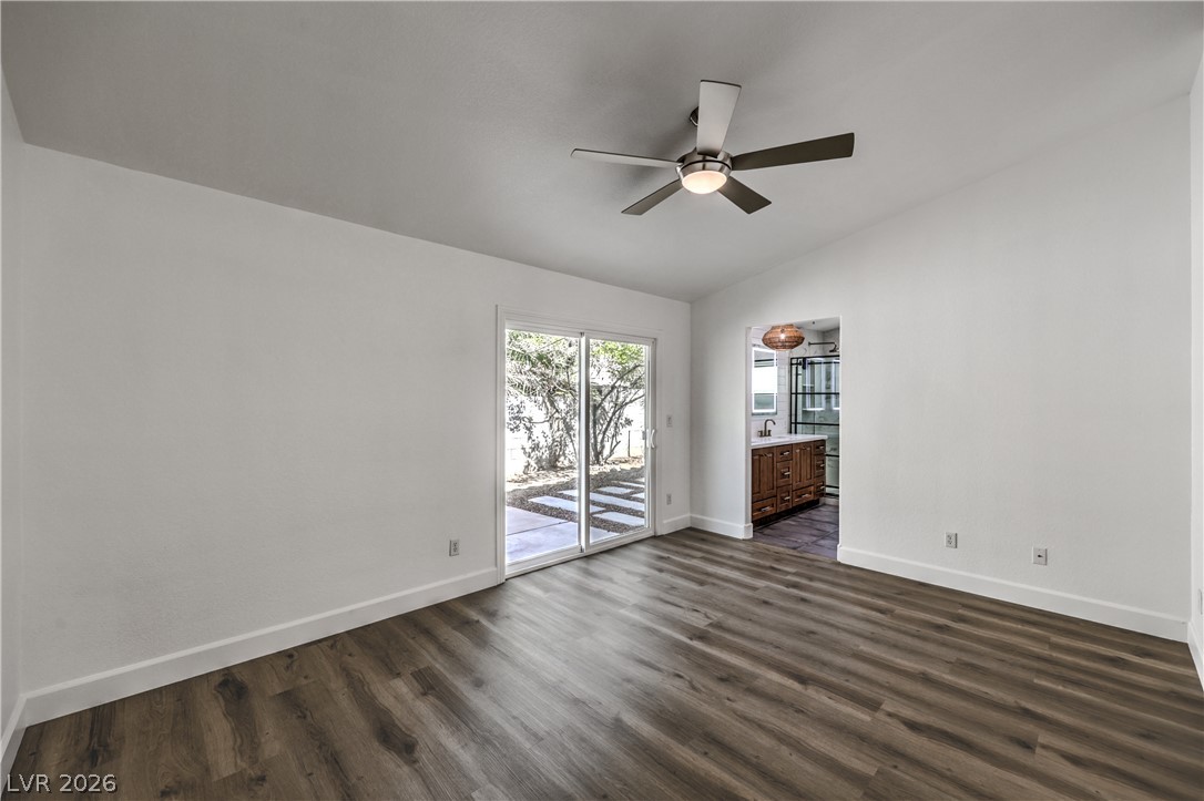 1900 Cardinal Point Street Henderson, NV 89012 - Photo 13 of 32 A well-lit interior space with wood flooring offers direct access to the outdoors through sliding glass doors.