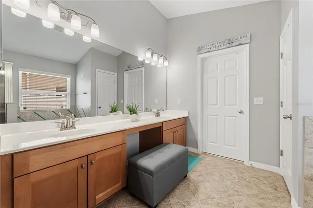 a spacious bathroom with a double vanity sink mirror and