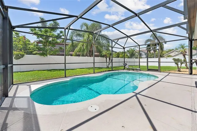 a view of yard with swimming pool