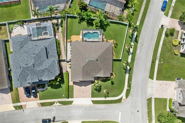 an aerial view of residential houses with outdoor space